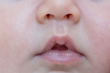 close up sleeping baby lips view. side portrait, macro photography.