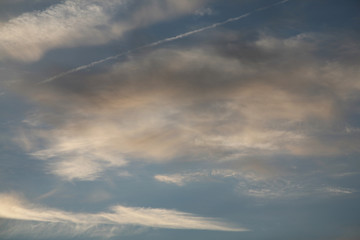 Clouds and sky. Abstract background image of the sky. The best picture of the sky with clouds. Beautiful sunset in the evening. The sun's rays illuminate the clouds.