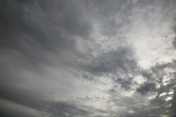 The sun's rays illuminate the sky with clouds. We see the background of the sky of natural color as in the picture. This image of a beautiful sky and white clouds pleases all people.