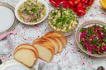 Salads and side dishes in plates on the table