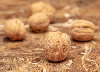 Walnuts on a marble table on the table