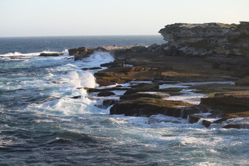 waves crashing on rocks