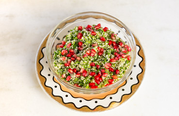 Middle eastern dish, vegetarian salad with parsley, mint and pomegranate.
