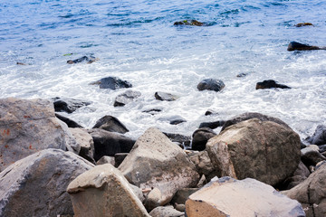 Rocky sea shore of Acitrezza next to Cyclops islands, Catania, Sicily, Italy