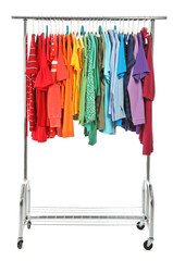 Naklejka premium Wardrobe rack with different colorful clothes on white background