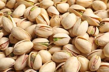 Organic pistachio nuts in shell as background