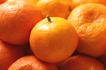 Pile of ripe tangerines as background, closeup