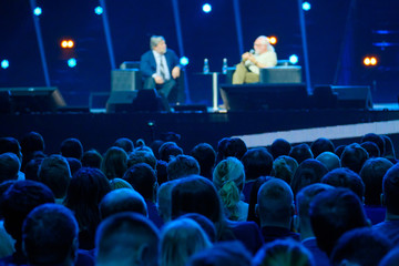 Audience listens to the lecturer at the conference hall