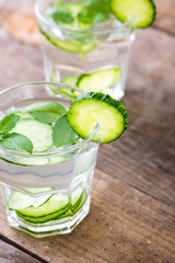 Cucumber water. Summer cool water with mint on table