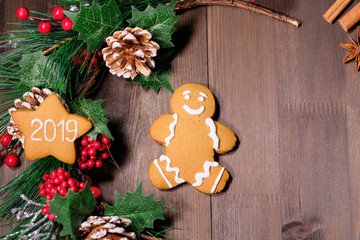 ginger biscuit  on brown wood background with Christmas tree 