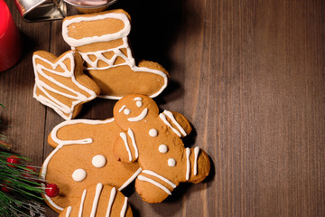 ginger biscuit on brown wood background with Christmas tree 