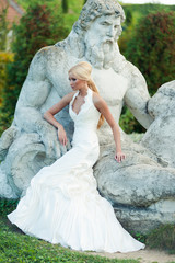 Bride blonde in a luxurious wedding dress