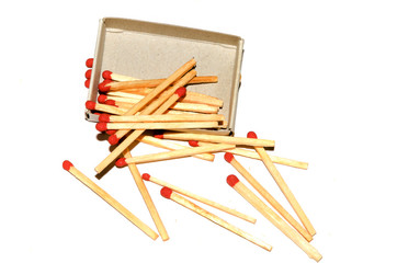 Chaotic scattered matches on a white background.