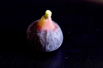 Fresh figs on black background