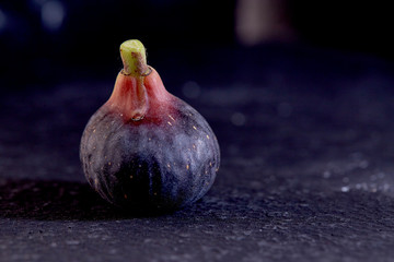 Fresh figs on black background
