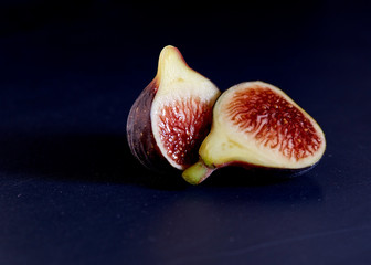 Fresh figs on black background