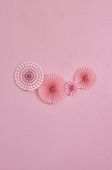 Pink wall and celebration object on the wall, baby girl background.