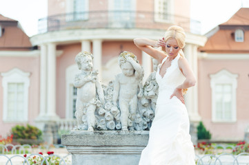 Fototapeta premium Bride blonde in a luxurious wedding dress
