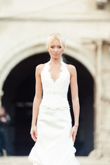 Bride blonde in a luxurious wedding dress