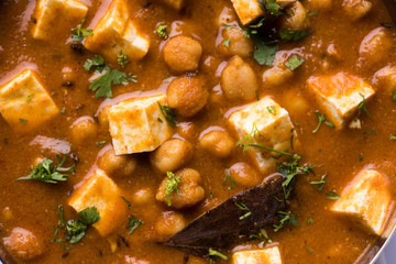 Chole Paneer curry made using boiled chickpea with cottage cheese with spices. Popular North Indian recipe. served in a bowl or serving pan. Selective focus