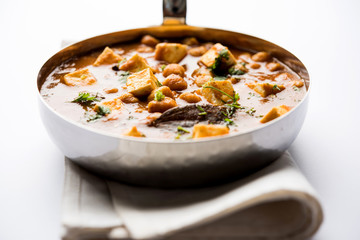 Chole Paneer curry made using boiled chickpea with cottage cheese with spices. Popular North Indian recipe. served in a bowl or serving pan. Selective focus