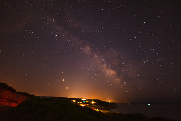 Fototapeta premium Milky way over Sardinia shoreline at night