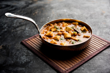 Chole Paneer curry made using boiled chickpea with cottage cheese with spices. Popular North Indian recipe. served in a bowl or serving pan. Selective focus