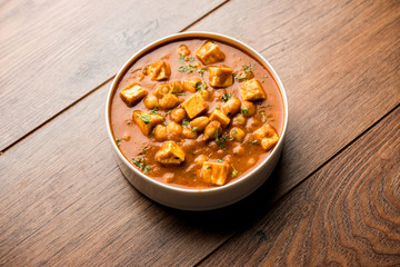 Chole Paneer curry made using boiled chickpea with cottage cheese with spices. Popular North Indian recipe. served in a bowl or serving pan. Selective focus