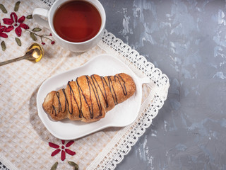 Christmas morning breakfast with tea and croissant