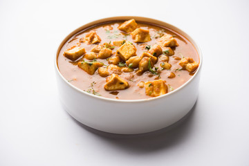 Chole Paneer curry made using boiled chickpea with cottage cheese with spices. Popular North Indian recipe. served in a bowl or serving pan. Selective focus