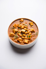 Chole Paneer curry made using boiled chickpea with cottage cheese with spices. Popular North Indian recipe. served in a bowl or serving pan. Selective focus