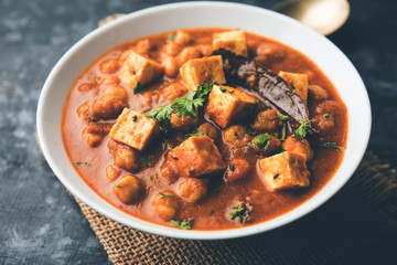 Chole Paneer curry made using boiled chickpea with cottage cheese with spices. Popular North Indian recipe. served in a bowl or serving pan. Selective focus