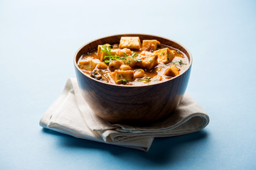 Chole Paneer curry made using boiled chickpea with cottage cheese with spices. Popular North Indian recipe. served in a bowl or serving pan. Selective focus