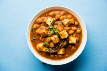 Chole Paneer curry made using boiled chickpea with cottage cheese with spices. Popular North Indian recipe. served in a bowl or serving pan. Selective focus