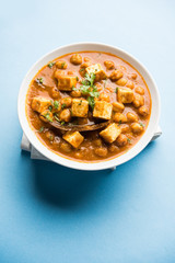 Chole Paneer curry made using boiled chickpea with cottage cheese with spices. Popular North Indian recipe. served in a bowl or serving pan. Selective focus