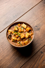 Chole Paneer curry made using boiled chickpea with cottage cheese with spices. Popular North Indian recipe. served in a bowl or serving pan. Selective focus