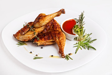 fried chicken on the grill with sauce