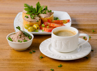 healthy breakfast with coffee and sandwiches, on a wooden table