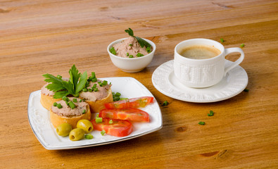 healthy breakfast with coffee and sandwiches, on a wooden table