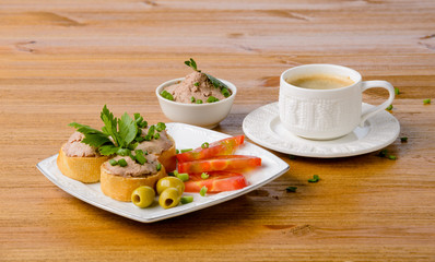 healthy breakfast with coffee and sandwiches, on a wooden table