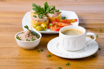 healthy breakfast with coffee and sandwiches, on a wooden table