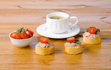 healthy breakfast with coffee and sandwiches, on a wooden table