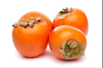 Persimmon fruits on white