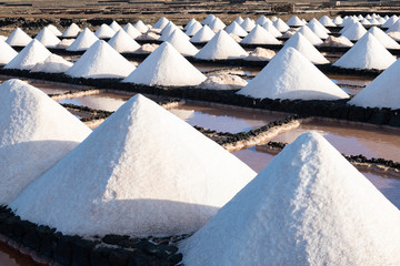 Salt piles on a saline exploration in salt factory refinery mines Janubio, Lanzarote, Canary...