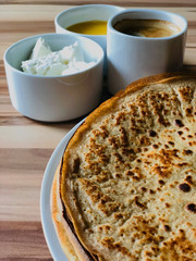 food Pancakes with local bee honey white cheese and black coffee close