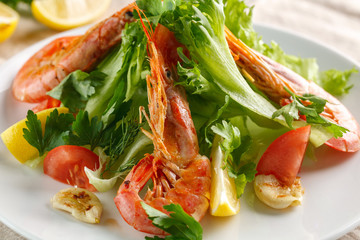 fresh salad with grilled shrimps with spices and tomatoes