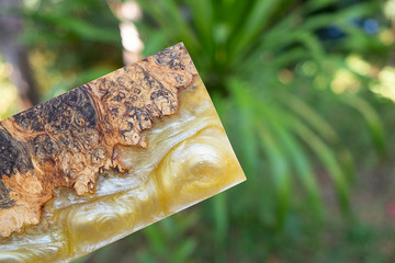 casting epoxy resin Stabilizing Afzelia burl exotic wood red yellow background, Abstract art picture photo, print design and your advertisement, hybrid