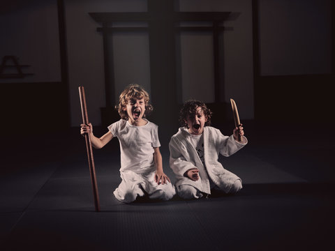 Screaming kids with knife and stick in gym