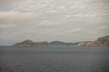 The island of es vedra from behind from a boat