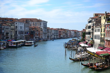 Beautiful colorful city of Venice, Italy, with Italian architecture, gondola, boats and bridges over canal